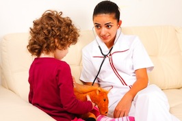 Doctor Chatting With Her Little Patient